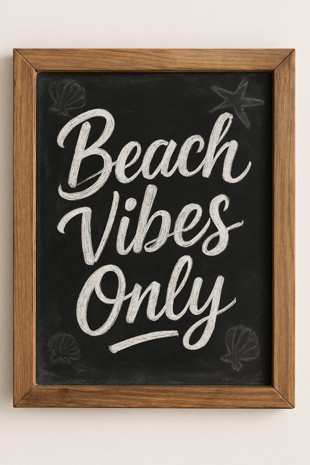 A wooden framed chalkboard sign with playful script lettering and subtle beach-themed decorations.