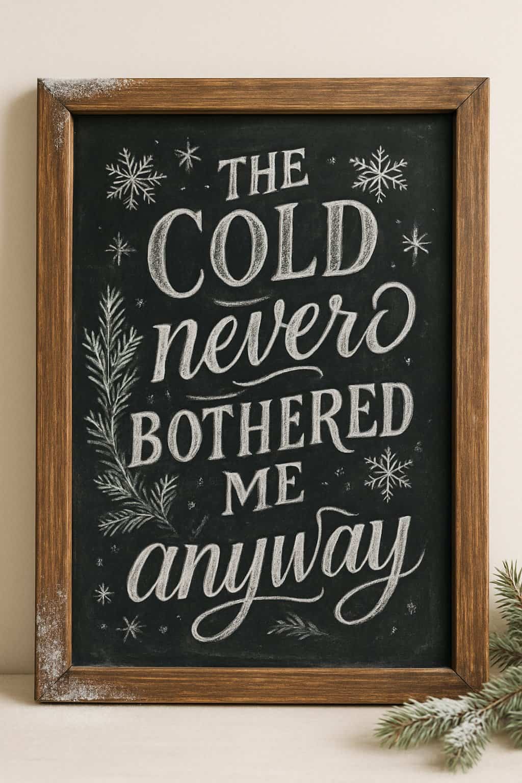 A wood framed chalkboard sign surrounded by winter decorations including snowflakes and pine branches.