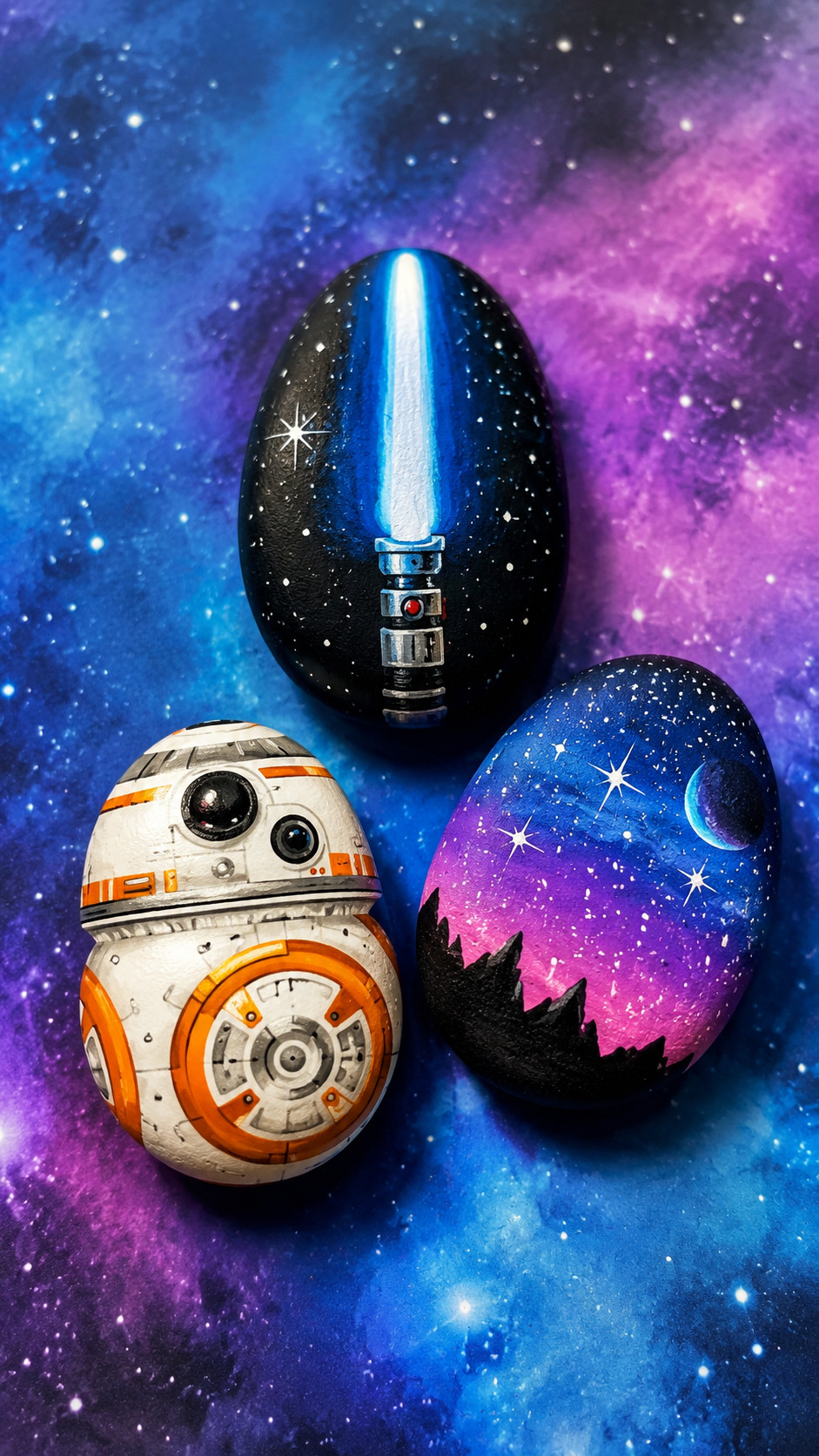 A painted Millennium Falcon rock with gray spacecraft details, blue accents, and a starry Star Wars-inspired background.