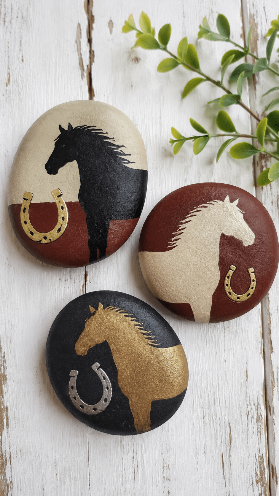 A painted rock featuring a galloping horse formed from colorful rainbow bands on a smooth stone.