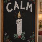 A hand-drawn christmas chalkboard sign reading "CALM".